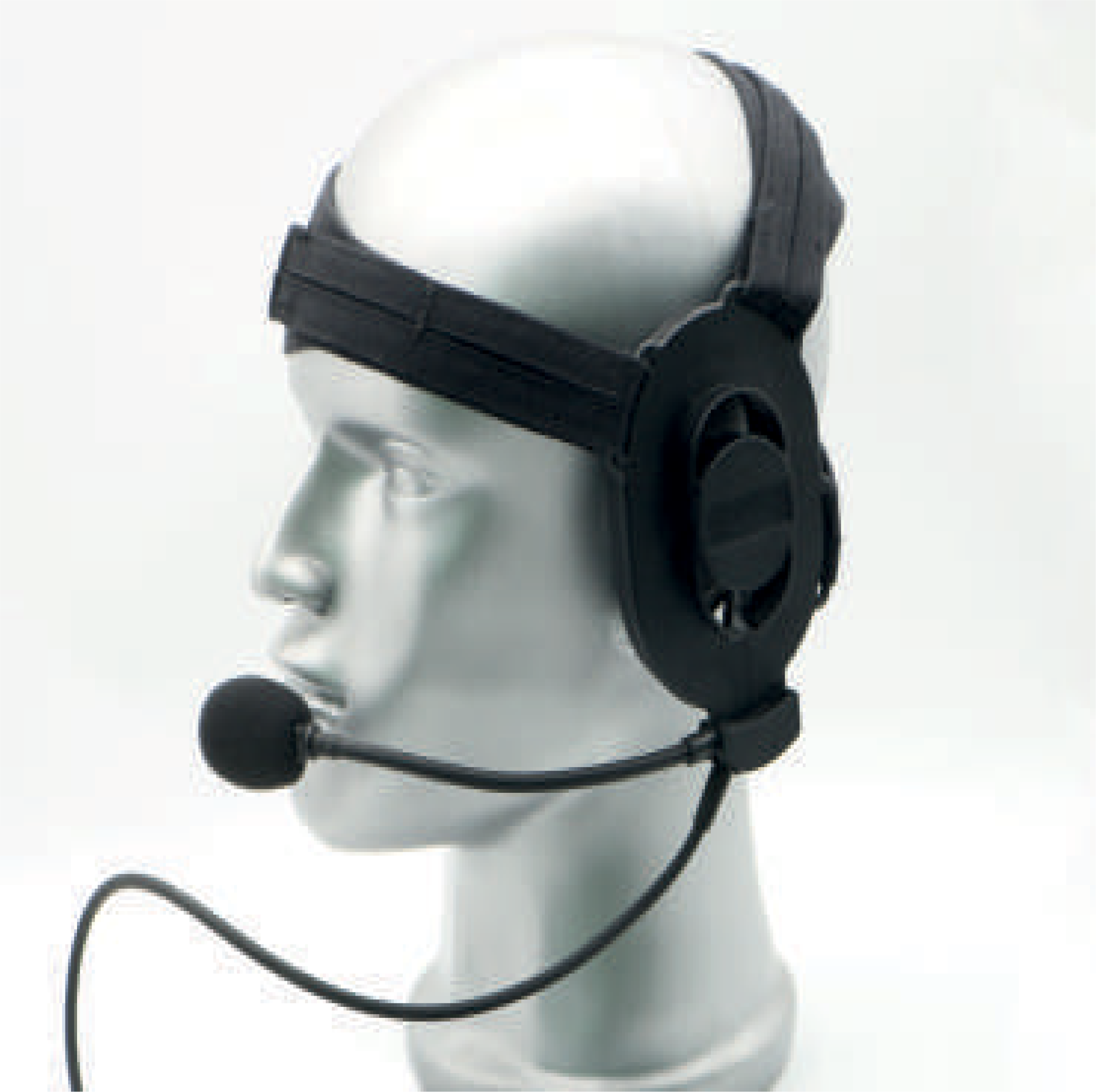 White mannequin head wearing a black VR headset with a strap across the top and round ear cups.